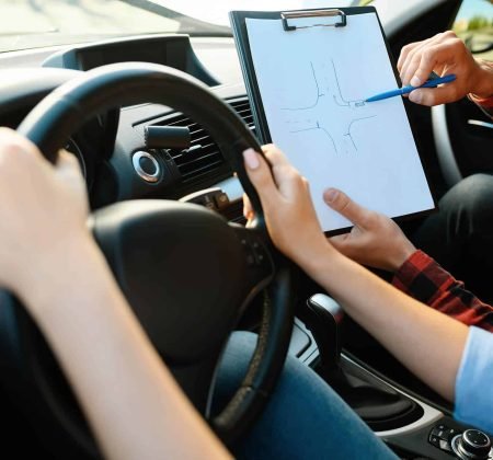 woman-and-man-with-checklist-driving-school-2021-08-28-17-17-18-utc.jpg